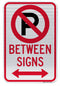 No Parking Symbol Between Signs (with Double Arrow) Sign