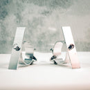 Two silver-colored metal brackets designed for mounting signs to a round pole, displayed against a neutral background.