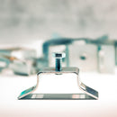 A silver-colored flare leg bracket for round pole, with a visible threaded bolt, against a blurred background.