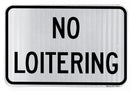 Horizontal no loitering sign made of aluminum with a white background and black text