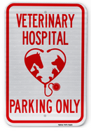 A red and white parking sign with the text 'Veterinary Hospital Parking Only' and a graphic of a stethoscope and a heart.
