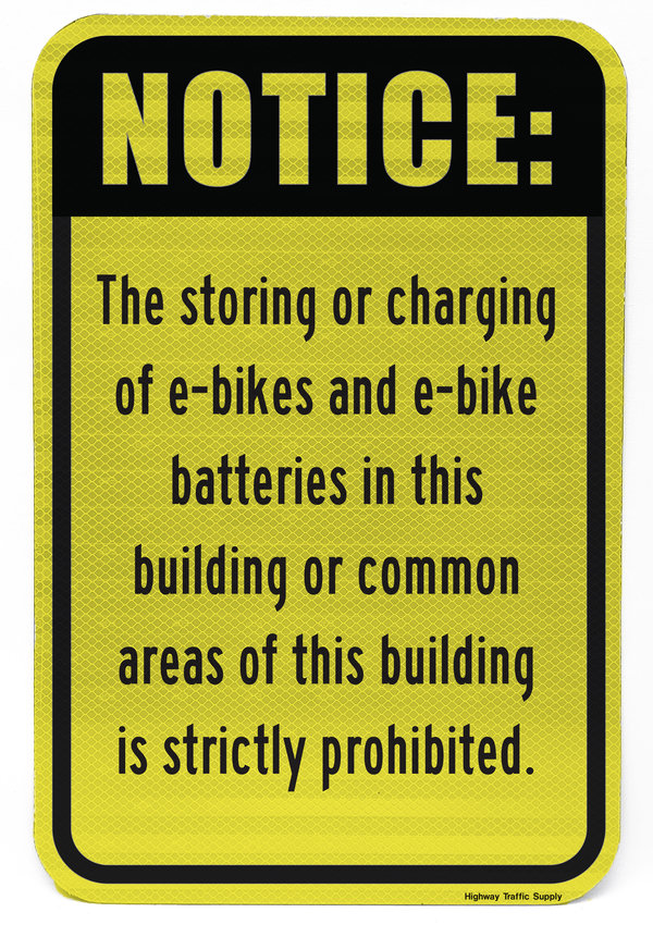Ebike and Battery Charging Prohibited in this building Sign on yellow sheeting front