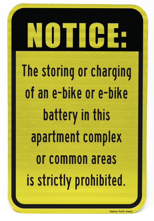 Ebike and Battery Charging Prohibited in Apartment Complex Sign on yellow front