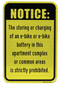 Ebike and Battery Charging Prohibited in Apartment Complex Sign on yellow front
